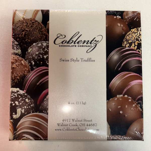 Box of assorted chocolate truffles in plastic wrap