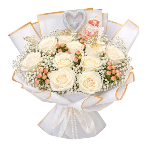 White rose bouquet with baby’s breath, pink berries, and silver heart topper
