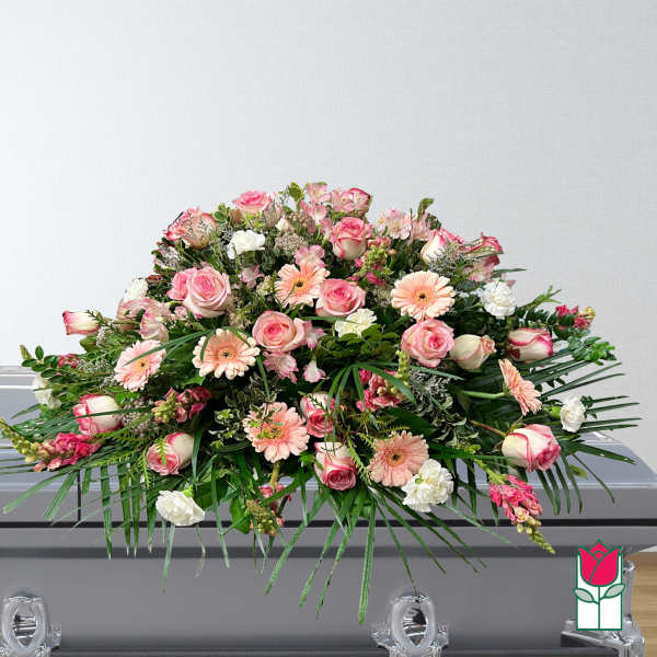 Large pink and white floral casket spray with roses and gerbera daisies