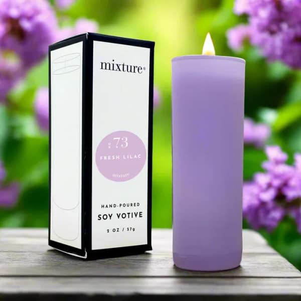 Lavender soy votive candle beside its box