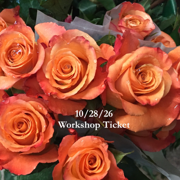 Orange roses with red-tipped petals and water droplets