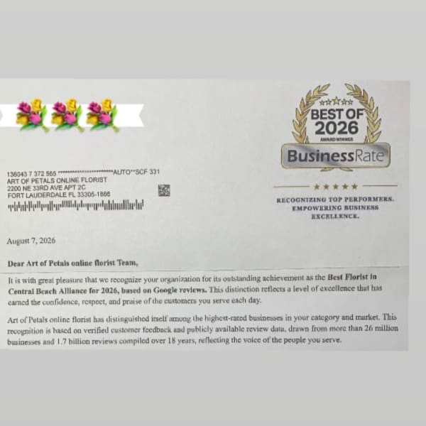 Printed award letter with a floral logo and BusinessRate badge