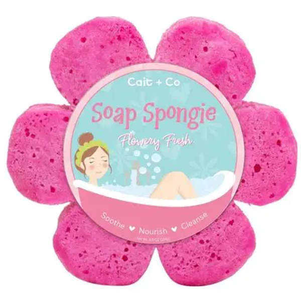 Pink flower-shaped soap sponge with a round label in the center