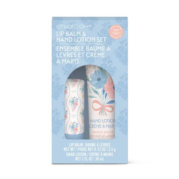 Blue boxed lip balm and hand lotion set with floral packaging