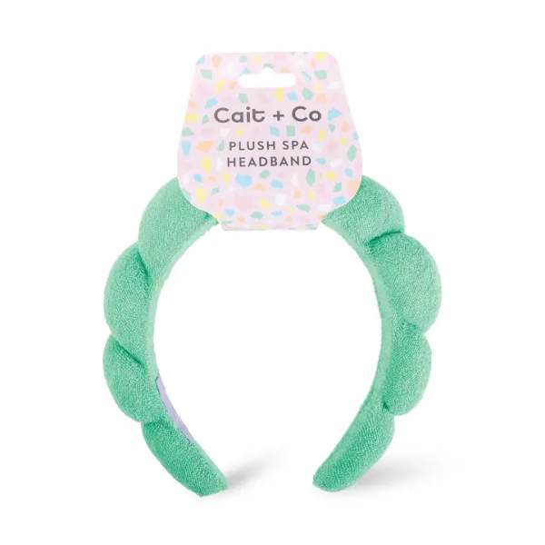 Mint green plush spa headband with a pastel Cait + Co tag