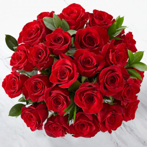 Bouquet of red roses with green leaves
