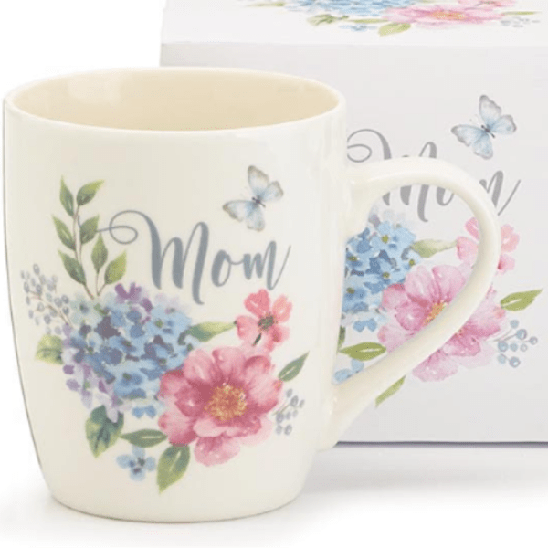 Cream ceramic mug with pastel flowers, butterflies, and the word Mom on the front