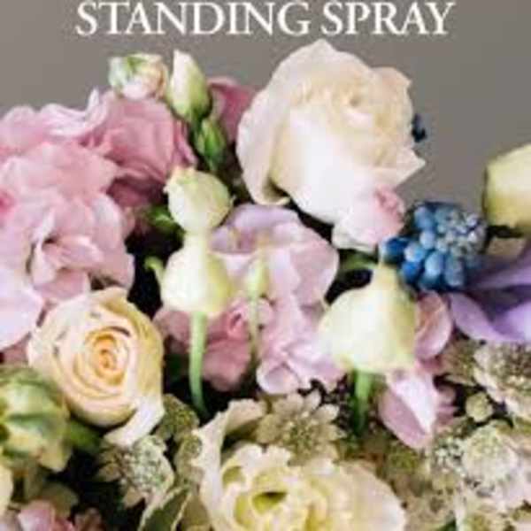 Pastel standing spray with roses, lilies, and hydrangea