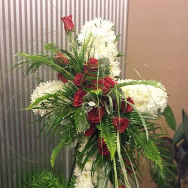 Tall standing floral spray with red roses and white flowers