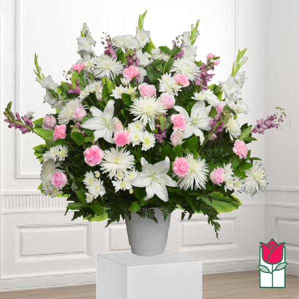 Large white and pink floral arrangement in a gray vase