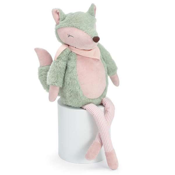 Plush fox toy sitting on a white cylinder