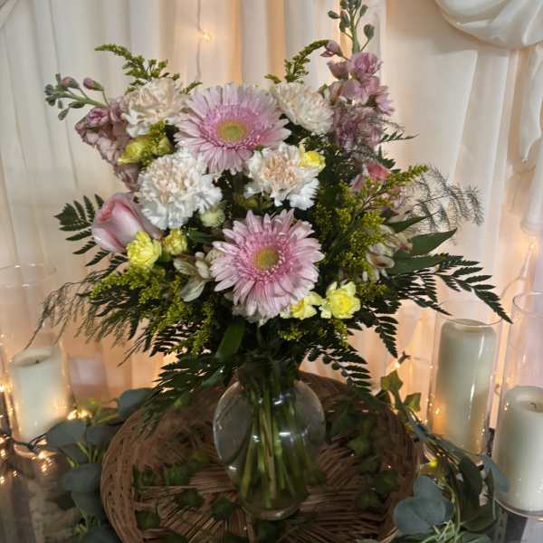 Pink and white mixed bouquet in a glass vase
