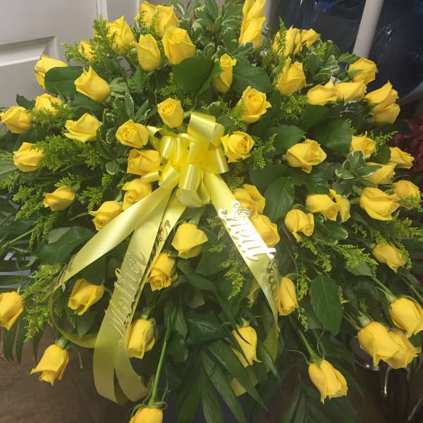 Large bouquet of yellow roses with a yellow ribbon