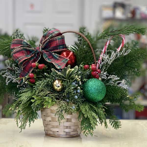 Small basket of foliage and Christmas decoration.