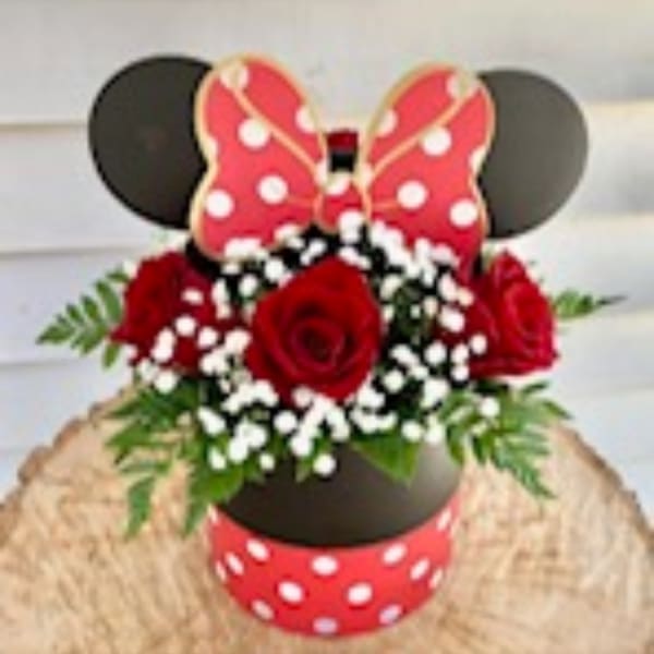 Minnie Mouse-themed bouquet with red roses and white filler flowers