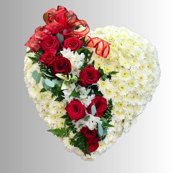 Heart-shaped floral arrangement with red roses and white chrysanthemums