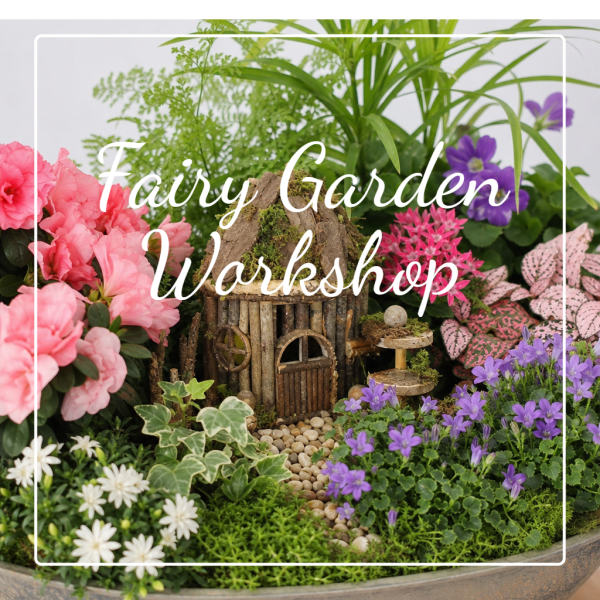Miniature garden display with pink and purple flowers in a bowl