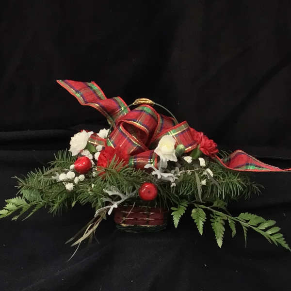 Holiday floral centerpiece with red plaid ribbon and white flowers