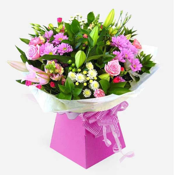 Pink and white mixed bouquet in a pink gift box with ribbon