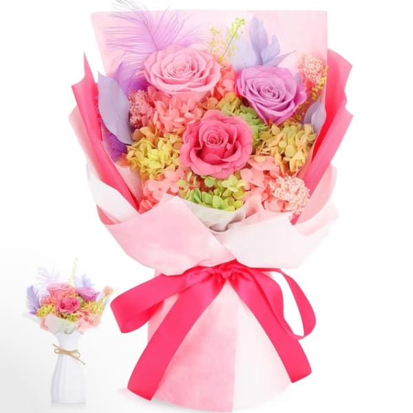 Pink and lavender bouquet with roses and hydrangeas wrapped in pink paper