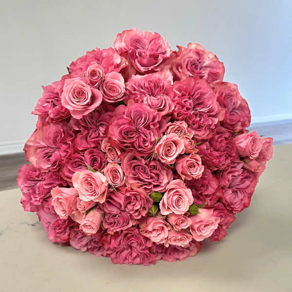 Large bouquet of pink roses in varying shades