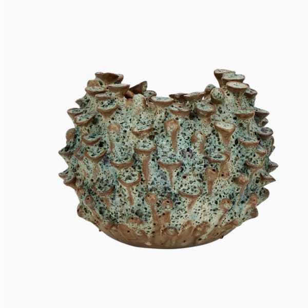 Textured ceramic vase with a blue-green and brown speckled surface