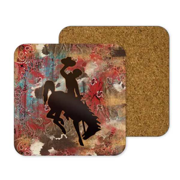 Two square cork coasters with a cowboy silhouette design
