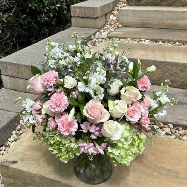 Pink and white mixed bouquet in a glass vase