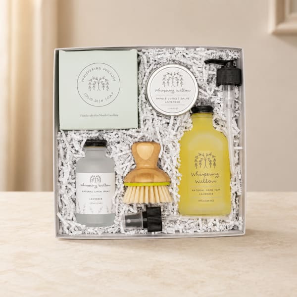 Lavender-themed gift set in a box with soap, salve, spray, soap dispenser, and brush