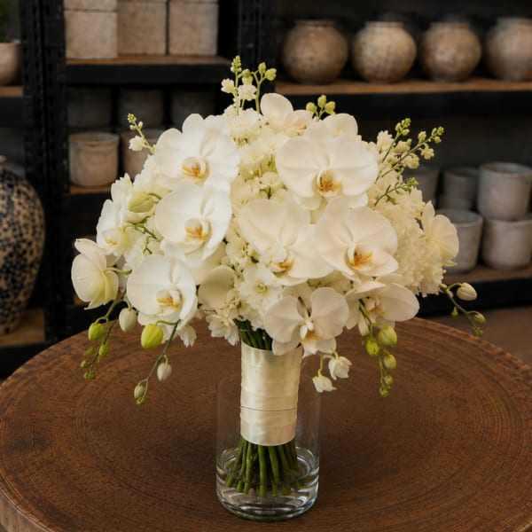 White orchid bouquet in a clear glass vase