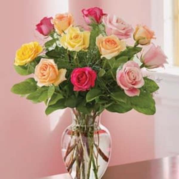 Mixed roses in a clear glass vase