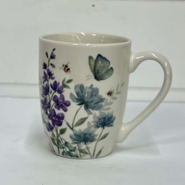 White ceramic mug with purple and blue floral and butterfly print