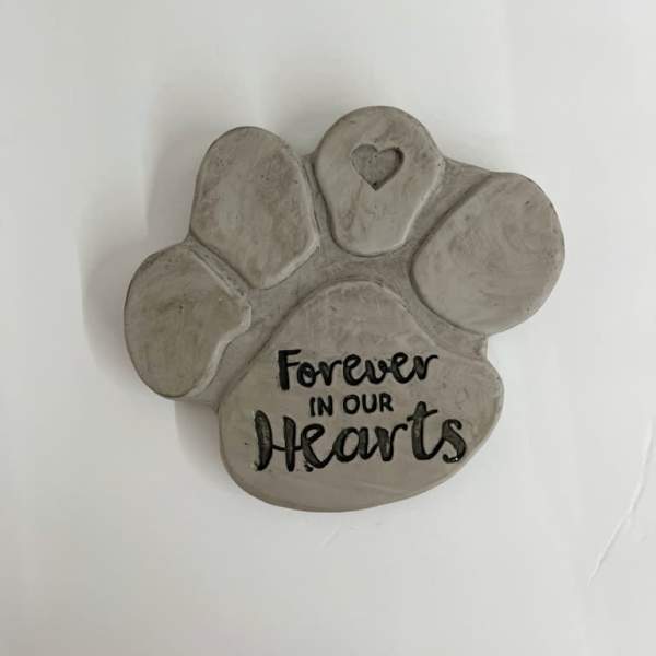 Gray paw print plaque with the words "Forever in our Hearts"