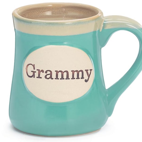 Turquoise ceramic mug with a cream oval label reading “Grammy” on the front