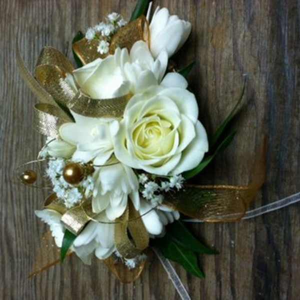 White rose and daisy bouquet with gold ribbon accents