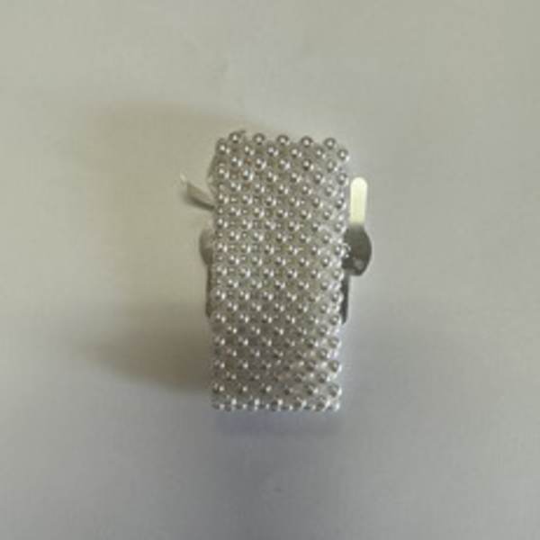 Silver beaded rectangular accessory with a small white accent