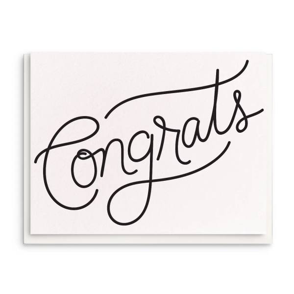 White card with the word "Congrats" in black script