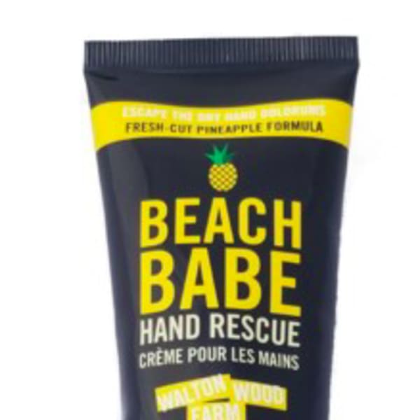 Black tube of Beach Babe hand rescue cream with yellow text