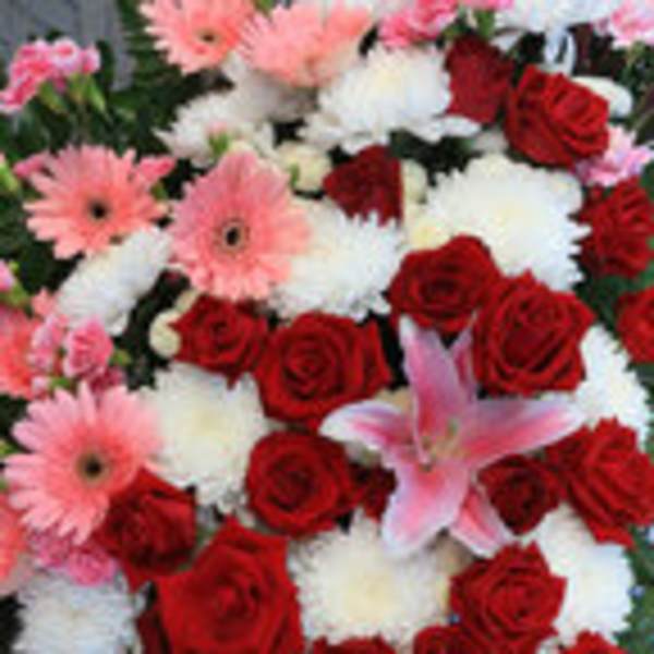 Bouquet of red roses, pink gerberas, white mums, and pink lilies