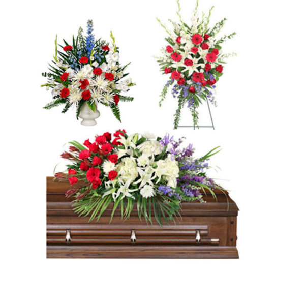 Floral casket spray with red, white, and purple flowers