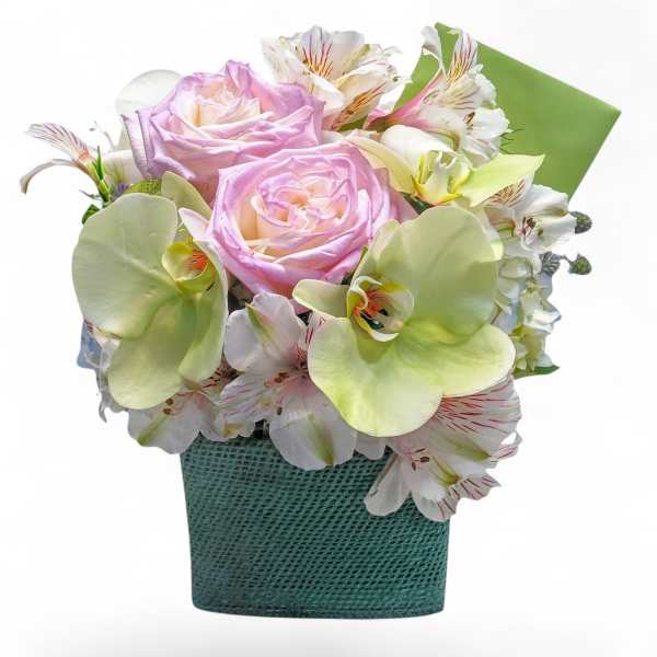 Pink roses and white alstroemeria in a teal textured container