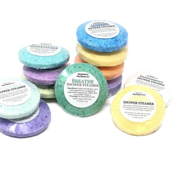 Stacked colorful shower steamers with labeled tops