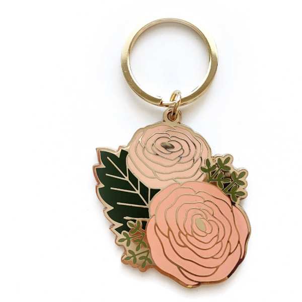Floral keychain with two pink rose charms and green leaves