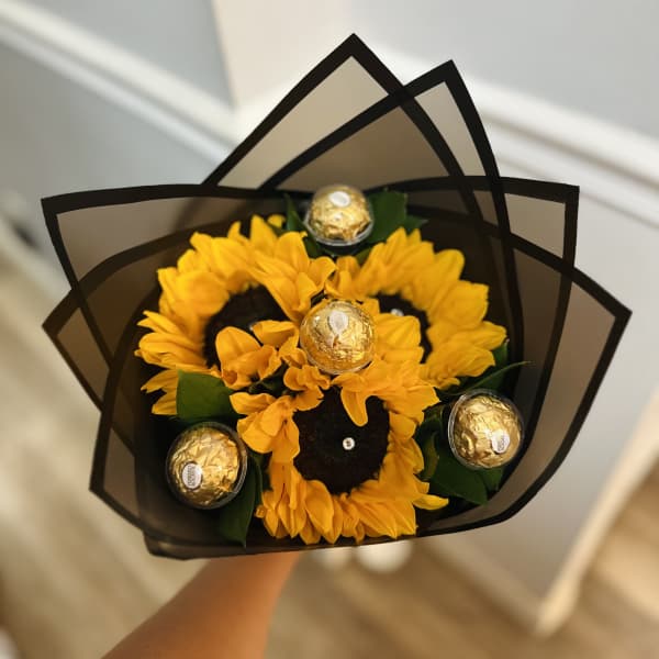 Sunflower bouquet with Ferrero Rocher chocolates in black wrap