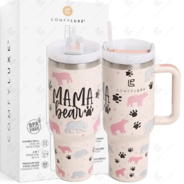 Set of two pink "Mama Bear" insulated tumblers with bear and paw print designs in front of a branded box