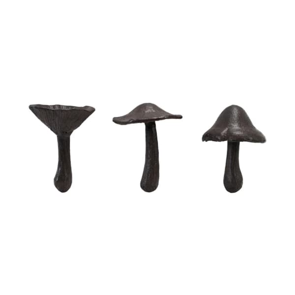 Three dark mushroom-shaped decorative objects on a white background