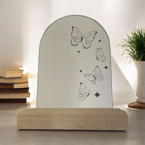 Butterfly-printed tabletop sign on a wooden base