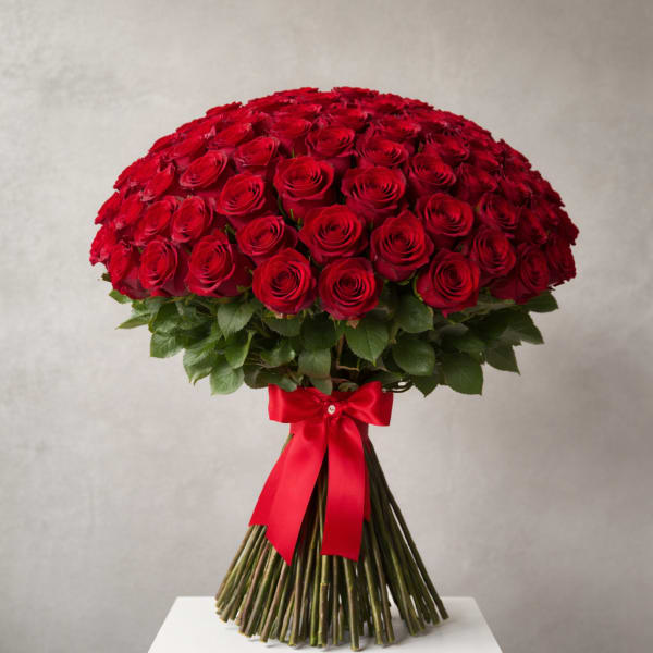 Large bouquet of red roses tied with a red ribbon