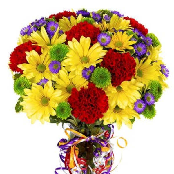 Bouquet of yellow daisies, red carnations, and purple asters in a glass vase