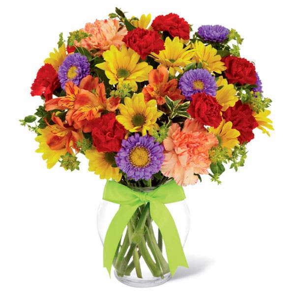 Colorful mixed bouquet in a clear glass vase with a green ribbon